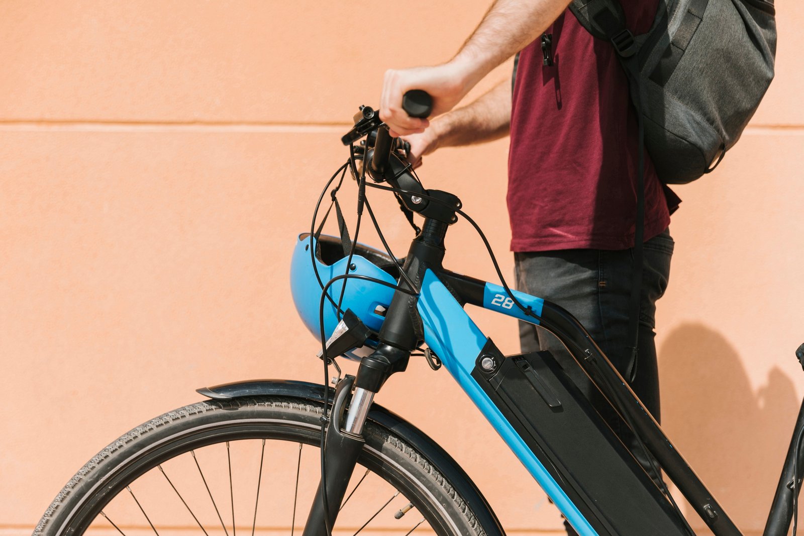 sideways cyclist standing e bike